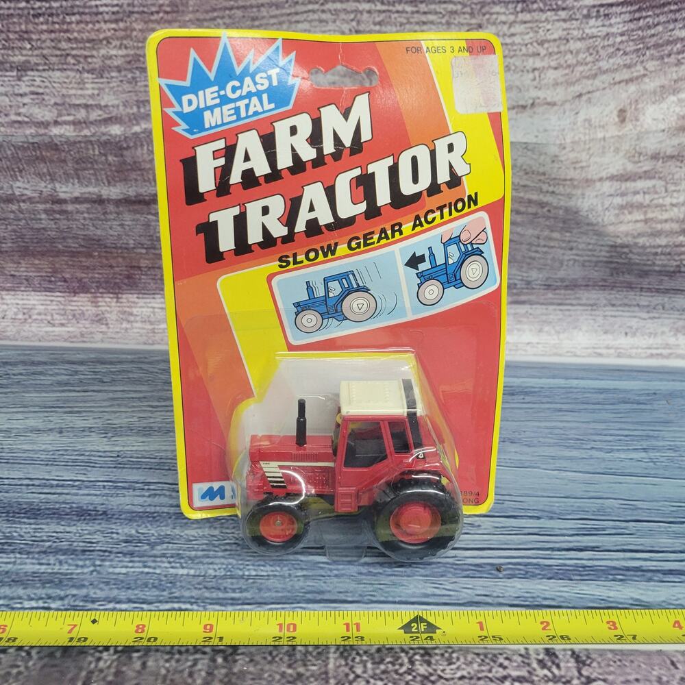 Vintage Unbranded die-cast pull and go red/white farm tractor sealed 1/43 scale